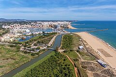 Aerial view of Vilamoura with coastline and docks, Algarve,