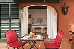 Set table for a drink in the terrace of a bedroom at Hotel Il Pellicano in Porto Ercole